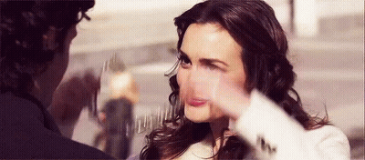 A Woman Is Making A Funny Face While A Man Is Taking A Picture Of Her . GIF