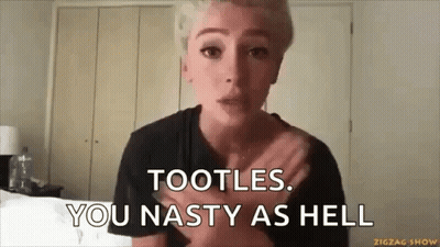 A Woman Is Making A Funny Face While Holding Her Chest And Saying Tootles . You Nasty As Hell . GIF
