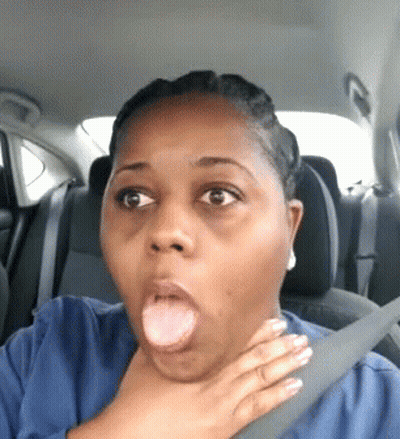 A Woman Is Making A Funny Face While Sitting In A Car With Her Hand On Her Neck . GIF