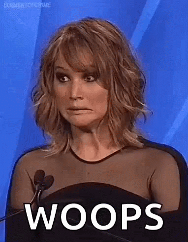 A Woman Is Making A Funny Face While Sitting In Front Of A Microphone And The Word Woops Is On The Screen . GIF