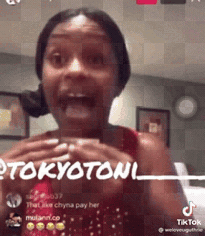 A Woman Is Making A Funny Face While Talking On A Tiktok Video . GIF