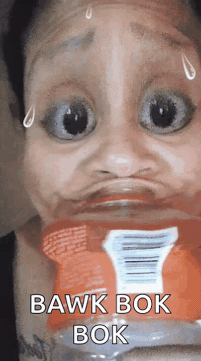 A Woman Is Making A Funny Face With A Bottle Of Soda In The Background . GIF