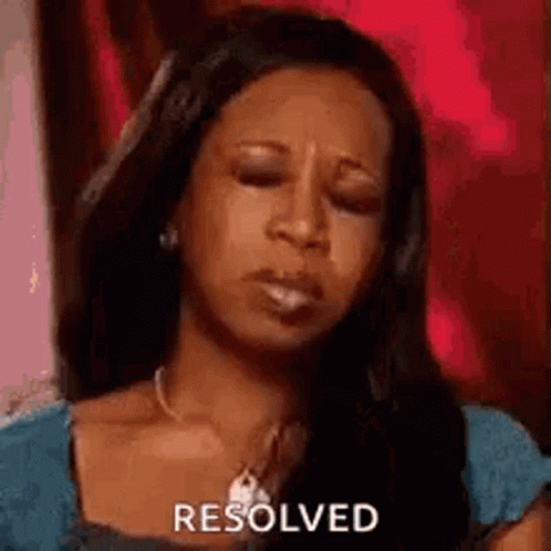 A Woman Is Making A Funny Face With Her Eyes Closed And The Word Resolved On Her Face . GIF
