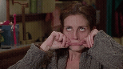 A Woman Is Making A Funny Face With Her Mouth GIF