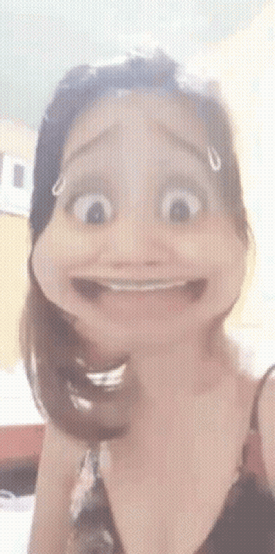 A Woman Is Making A Funny Face With Her Mouth Open And Making A Cartoon Face . GIF