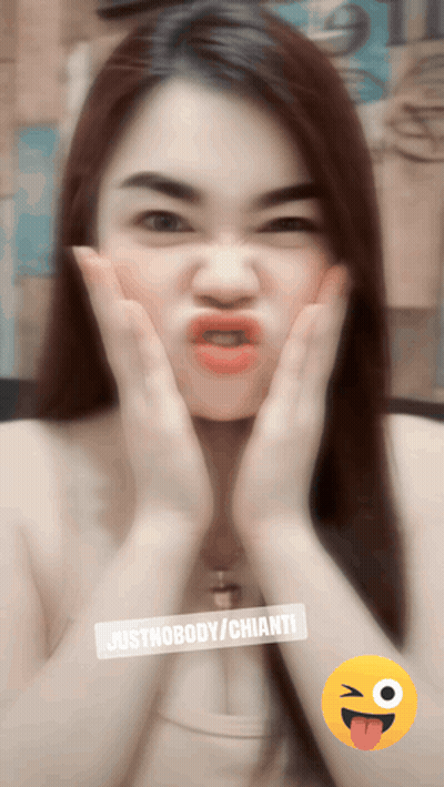 A Woman Is Making A Funny Face With Justnobody / Chianti Written On The Bottom GIF