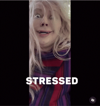 A Woman Is Making A Funny Face With The Word Stressed Behind Her GIF