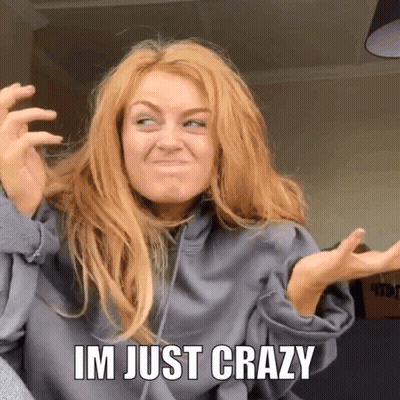 A Woman Is Making A Funny Face With The Words Im Just Crazy Behind Her GIF