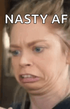 A Woman Is Making A Funny Face With The Words `` Nasty Af '' Written On The Bottom . GIF