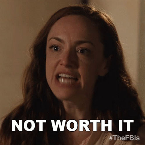 A Woman Is Making A Funny Face With The Words Not Worth It Below Her GIF
