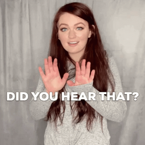 A Woman Is Making A Gesture With Her Hands And The Words Did You Hear That Behind Her . GIF