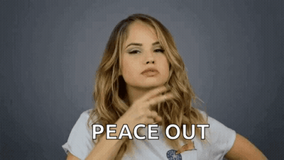 A Woman Is Making A Peace Out Sign With Her Finger GIF