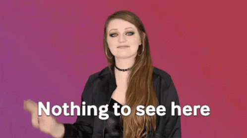 A Woman Is Making A Peace Sign With Her Hand And The Words `` Nothing To See Here '' Behind Her . GIF