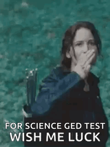 A Woman Is Making A Peace Sign With Her Hand While Standing In The Water . GIF