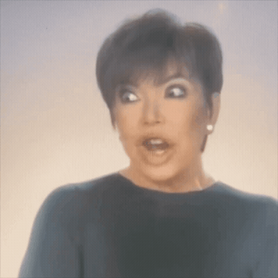 A Woman Is Making A Surprised Face With Her Mouth Open . GIF
