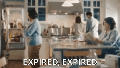 A Woman Is Opening A Refrigerator Door In A Kitchen While A Family Looks On . GIF
