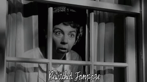 A Woman Is Peeking Out Of A Window With The Words Bewitched Fanpage Written Below Her GIF