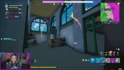 A Woman Is Playing A Video Game With Salty Tony On The Screen GIF