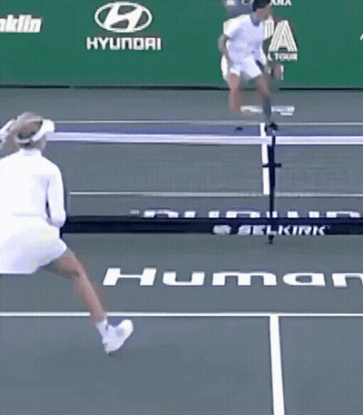 A Woman Is Playing Tennis On A Court With An Ad For Franklin Hyundai Behind Her GIF