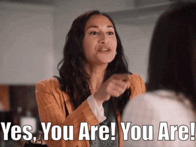 A Woman Is Pointing At Another Woman And Saying Yes You Are GIF