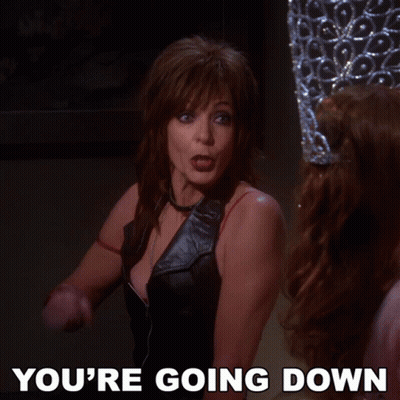 A Woman Is Pointing At Another Woman With The Words You 'Re Going Down Below Her GIF