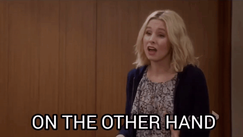 A Woman Is Pointing At Something With The Words " Snitches Do Get Stitches " Written Below Her GIF