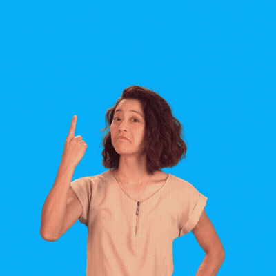 A Woman Is Pointing Up In Front Of A Sign That Says Fact GIF