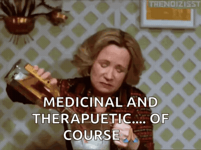 A Woman Is Pouring A Drink From A Bottle Into A Cup And Says `` Medicinal And Therapeutic ... Of Course '' . GIF