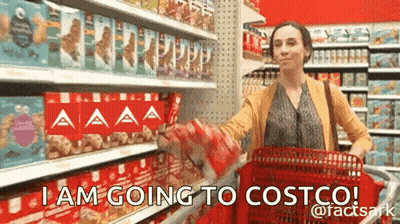 A Woman Is Pushing A Shopping Cart In A Store And Says I Am Going To Costco . GIF