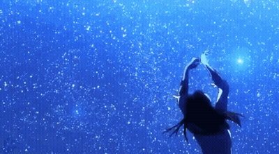 A Woman Is Reaching Up Towards A Star In The Sky GIF