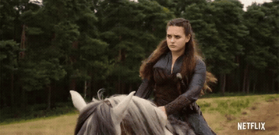 A Woman Is Riding A Horse In A Field With Netflix Written On The Bottom Of The Screen GIF