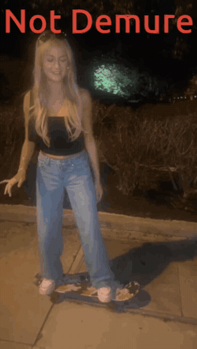 A Woman Is Riding A Skateboard With The Words Not Demure Written Above Her GIF