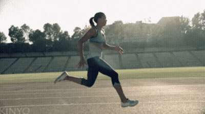 A Woman Is Running On A Track That Says Kinjyo On It GIF