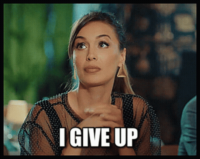 A Woman Is Saying I Give Up With Her Hands Folded In Front Of Her Face GIF