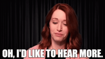 A Woman Is Saying Oh I 'D Like To Hear More GIF