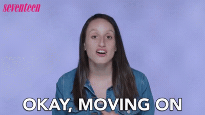A Woman Is Saying Okay , Moving On In Front Of A Purple Background . GIF