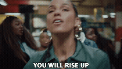 A Woman Is Saying `` You Will Rise Up '' In Front Of A Crowd . GIF