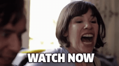 A Woman Is Screaming And Saying Watch Now In Front Of A Man GIF