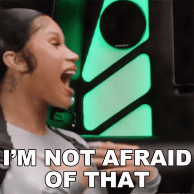 A Woman Is Screaming With Her Mouth Open And Says `` I 'M Not Afraid Of That '' . GIF