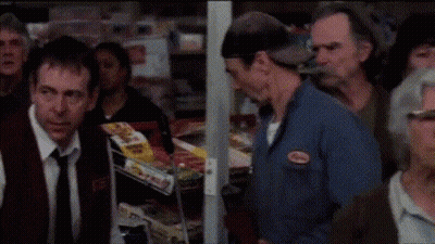 A Woman Is Screaming With Her Mouth Open GIF