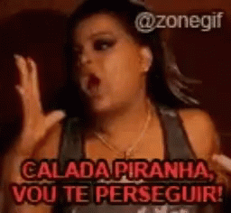 A Woman Is Screaming With The Words Calada Piranha Vou Te Perseguir Written Above Her GIF