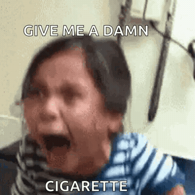 A Woman Is Screaming With The Words Give Me A Damn Cigarette Written Above Her GIF