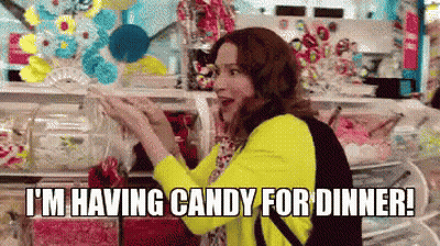 A Woman Is Shopping For Candy In A Store And Says `` I 'M Having Candy For Dinner '' GIF
