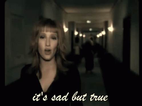A Woman Is Singing In A Hallway With The Words It 'S Sad But True Below Her GIF