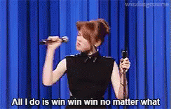 A Woman Is Singing Into A Microphone And Says All I Do Is Win Win Win No Matter What . GIF