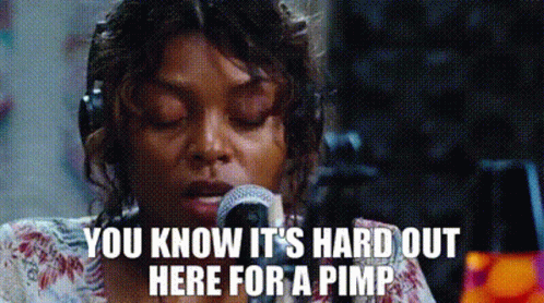 A Woman Is Singing Into A Microphone And Says `` You Know It 'S Hard Out Here For A Pimp '' GIF