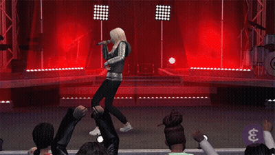 A Woman Is Singing Into A Microphone On A Stage In Front Of A Crowd GIF
