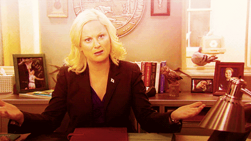 A Woman Is Sitting At A Desk In Front Of A Seal That Says Washington GIF