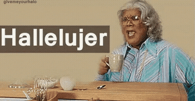 A Woman Is Sitting At A Desk With A Cup Of Coffee And A Sign That Says Hallelujar GIF