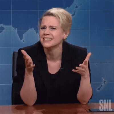 A Woman Is Sitting At A Desk With Her Arms Outstretched In Front Of A Map On The Wall . GIF